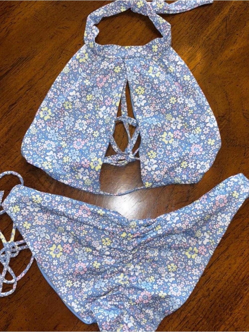 Frankie’s Bikinis blue floral bikini top and medium bottom